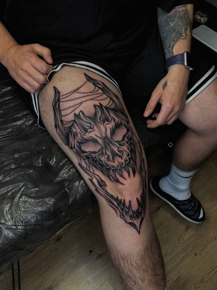 a man with a tattoo on his leg