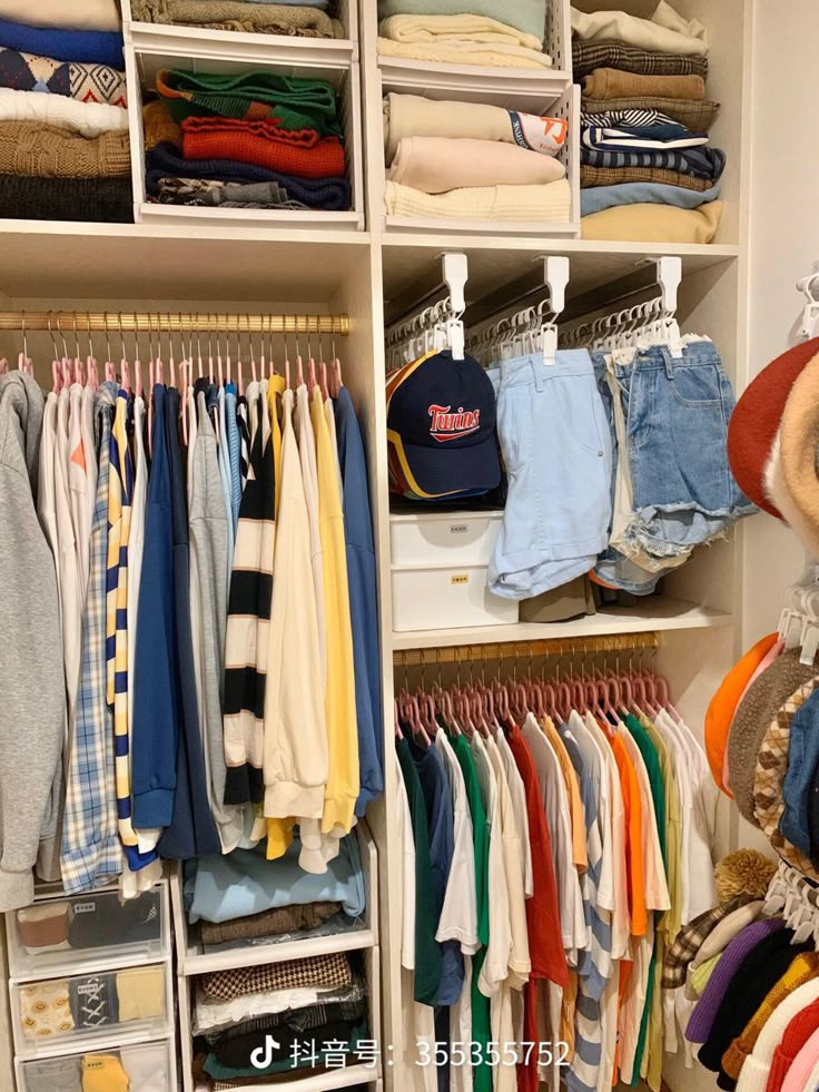 a closet filled with lots of different types of clothes