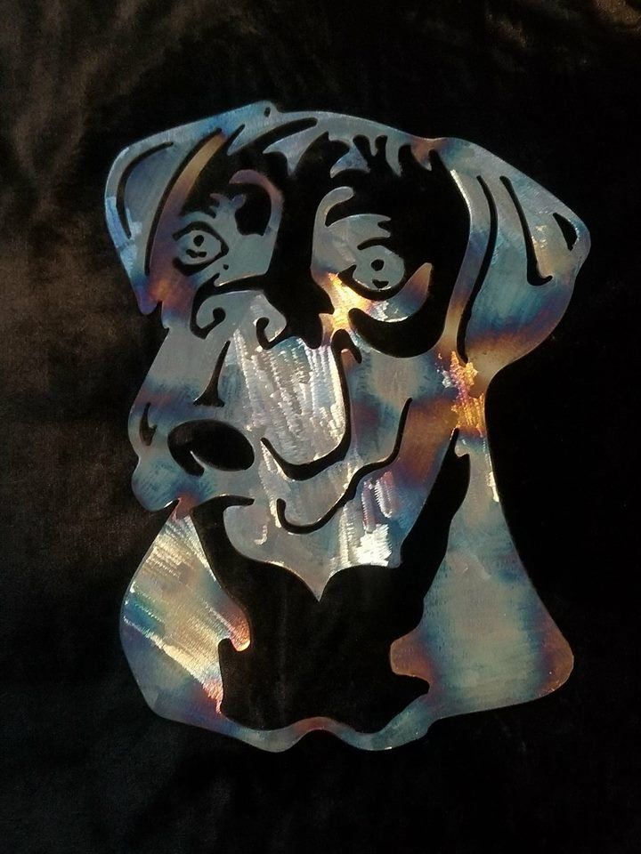 a metal object with a dog's face on it