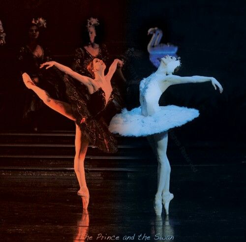 two ballerinas in black and white tutus, one is holding her leg up