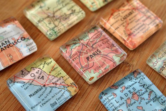 many small maps are placed on a wooden table with the words san francisco printed on them