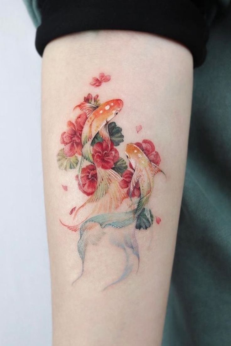 a woman's arm with a dog and flowers on it