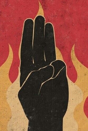 a black hand with flames on it is in the middle of a red and yellow background