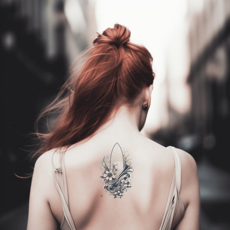 a woman with a tattoo on her back