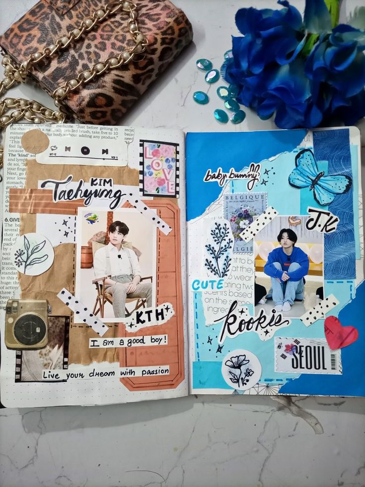 an open scrapbook with blue flowers and other items on it, including a purse