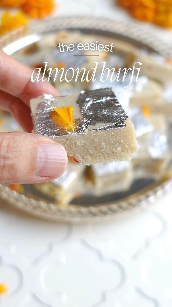 a hand holding a piece of cake on top of a plate with the words, the earliest almond bunt