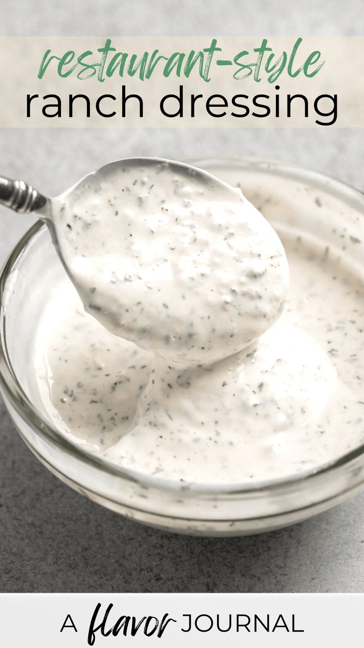 a spoon full of ranch dressing in a glass bowl with the words, restaurant style ranch dressing