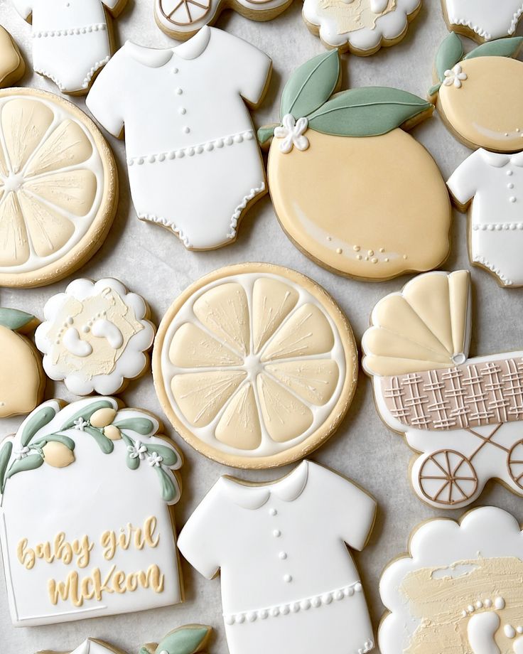 decorated cookies with baby clothes and lemons