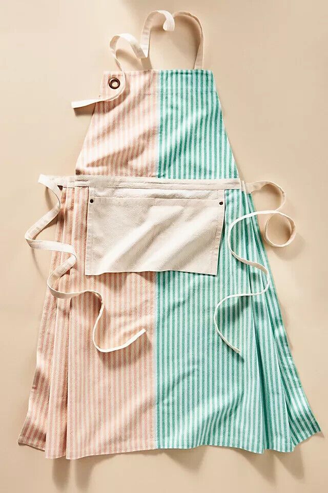 two aprons are laid out on top of each other