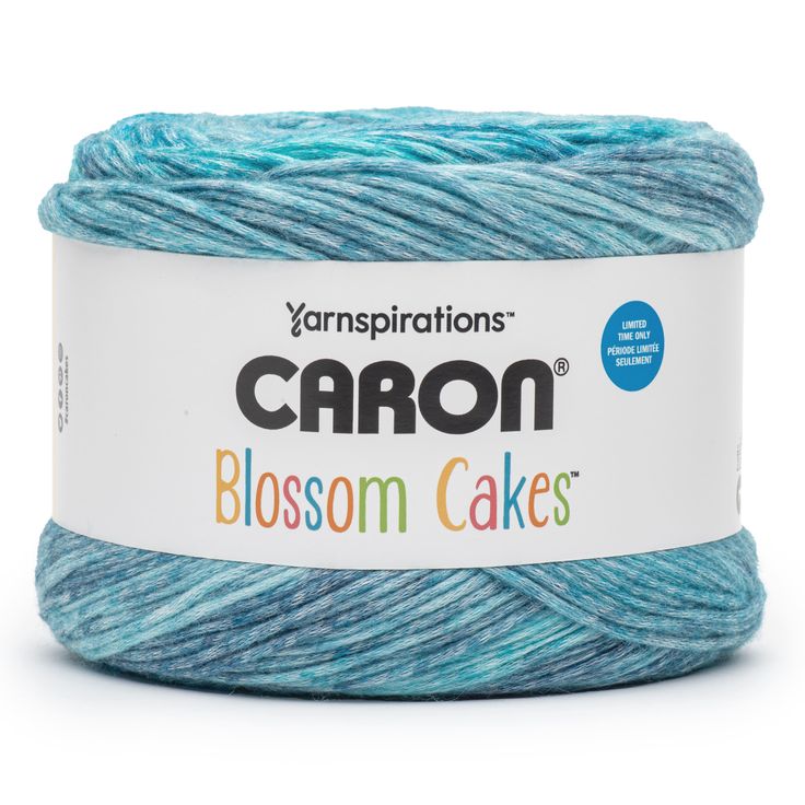 yarn that is blue and green with the words caron blossom cakes written on it