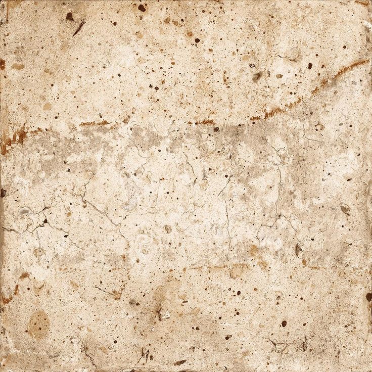 an old, dirty white tile with brown spots on it's surface is shown in this image