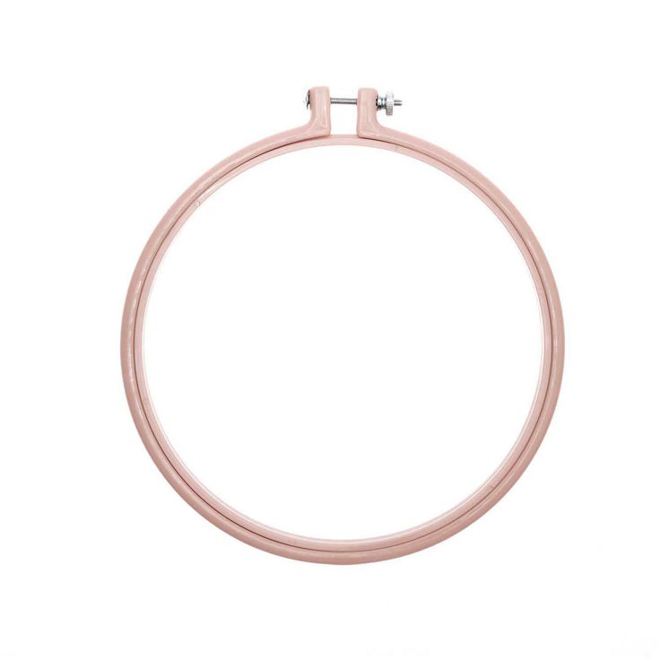 a close up of a pink ring on a white background