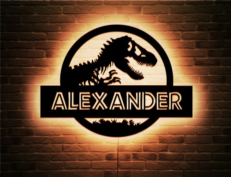 the illuminated sign for alex ander's restaurant in front of a brick wall