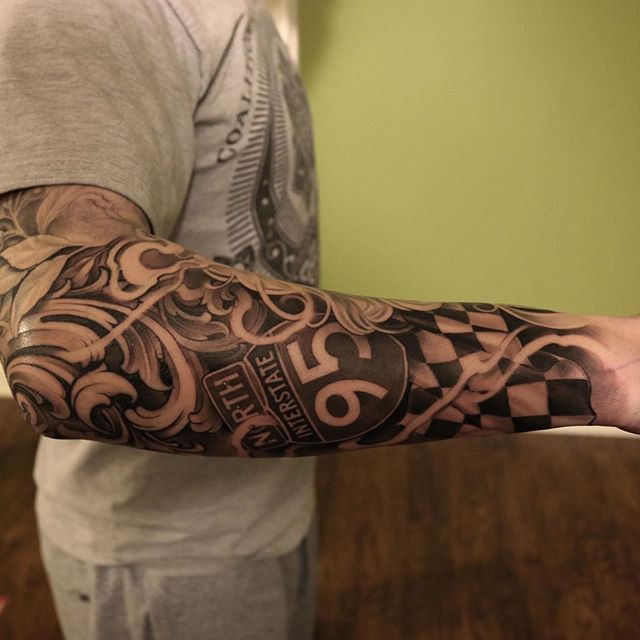 a man with a tattoo on his arm