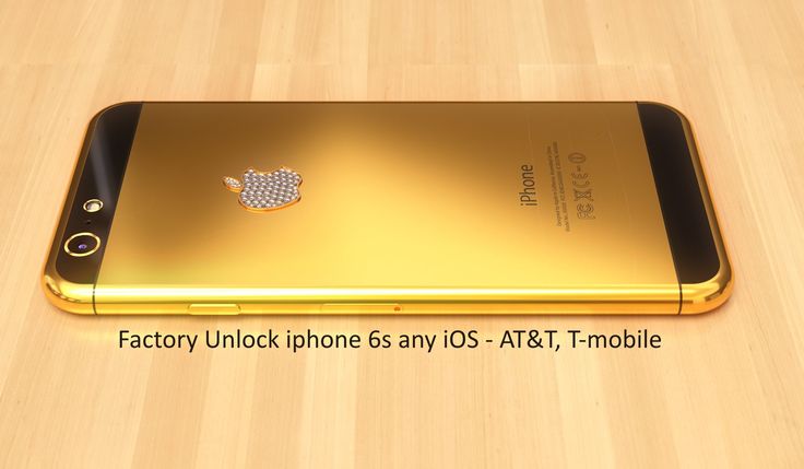 the gold iphone is sitting on a wooden table