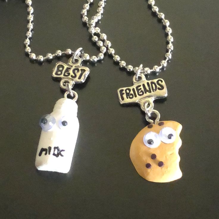 two necklaces that say best friends and one has a bottle with googly eyes