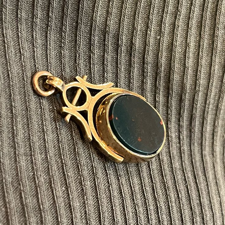 This Gorgeous Gold Antique Charm Is Double Sided Carnelian And Bloodstone And Spins. The Gold Is 9ct And That Rich Warm Gold Color Only Antiques Have. The Bloodstone Is Lightly Chipped And Scuffed On The Edges But This Is Barely Visible Unless Close Up. The Gold On The Sides Of The Fob Shows Signs Of Wear From The Spinning Action. This Is So Stunning And Dramatic And Gothic. Perfect Charm For A Watch Chain Dog Clip Necklace. Dog Clip, Watch Chain, Womens Jewelry Necklace, Spinning, Onyx, Gold Color, Close Up, Double Sided, Jewelry Necklaces