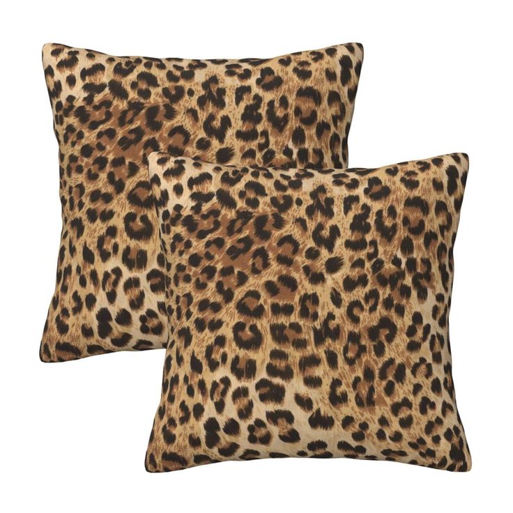 two leopard print pillows sitting on top of each other