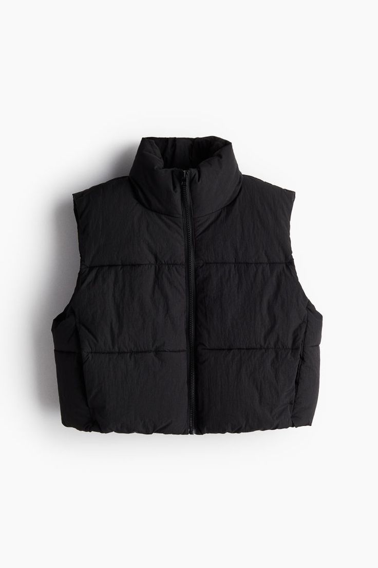 Short puffer vest in quilted  woven fabric. Stand-up collar  zipper at front  and discreet front pockets. Lined. Black Puffer Vest Cropped, Winter Workwear Puffer Vest, Navy Wishlist, Black Vest Puffer, Mini Puffer Vest, Short Puffer Vest, Puffer Vest Cropped, Gifts Wishlist, Realistic Wishlist