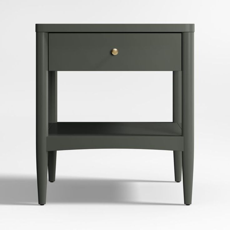 the side table is painted dark green and has an open drawer on one end, with gold knobs at the top