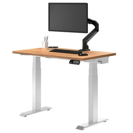 a computer desk with a monitor, keyboard and mouse on it in front of a white background