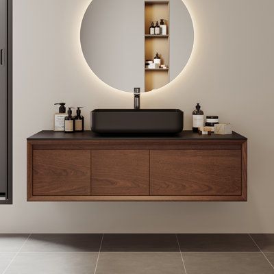 a bathroom with a sink, mirror and shelves on the wall in front of it