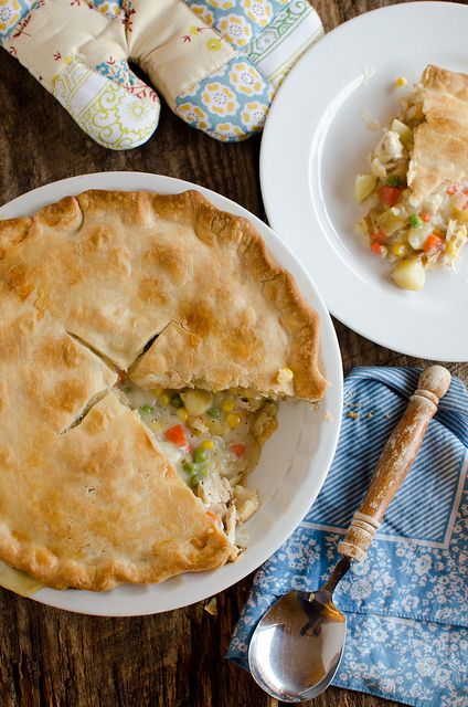 there is a pie on the table with two plates