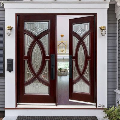 the front door to a house with two glass doors on each side and an entry way