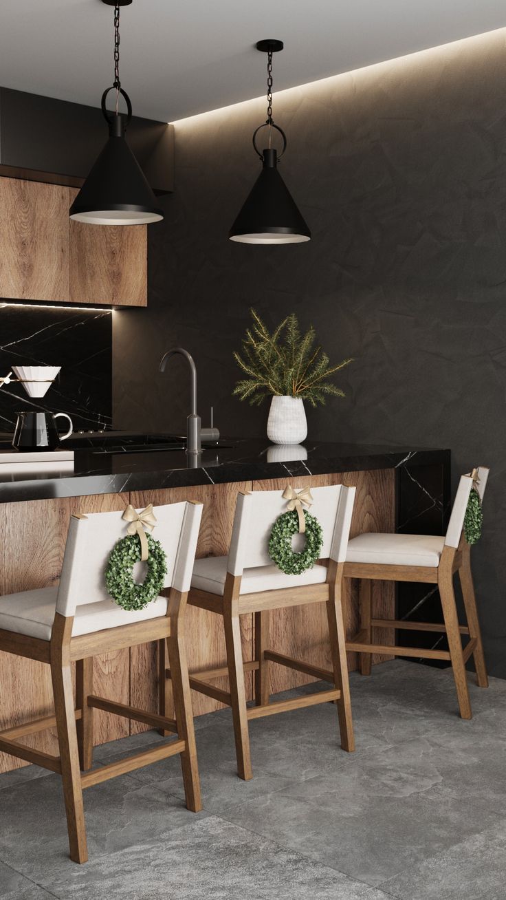 three chairs are in front of a kitchen island with wreaths on the backrest