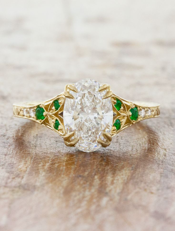 caption:1.75ct oval diamond Engagement Rings With Emerald Accents, Twist Wedding Band, Stone Shapes, Pretty Engagement Rings, Engraved Engagement Ring, Lab Diamond Engagement Ring, Vintage Wedding Band, Curved Wedding Band, Yellow Gold Setting