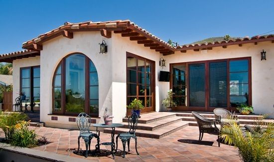 an outdoor patio with chairs and tables