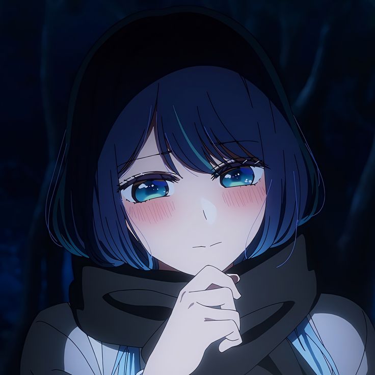 a girl with blue eyes and black hair is looking at the camera while wearing a scarf