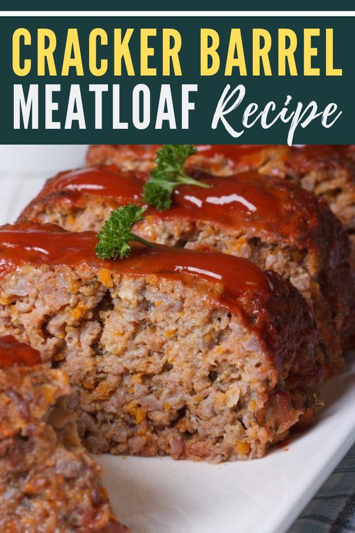 meatloaf with ketchup and sauce on a white platter next to another meatloaf