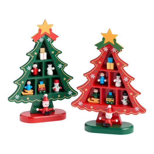 two small christmas trees with decorations on them