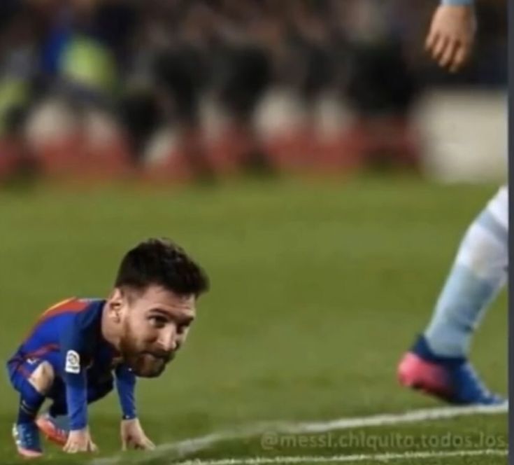 a soccer player with his head down on the ground