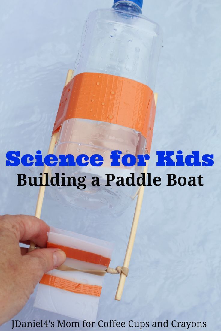 a hand holding a water bottle on a stick with the words science for kids building a paddle boat