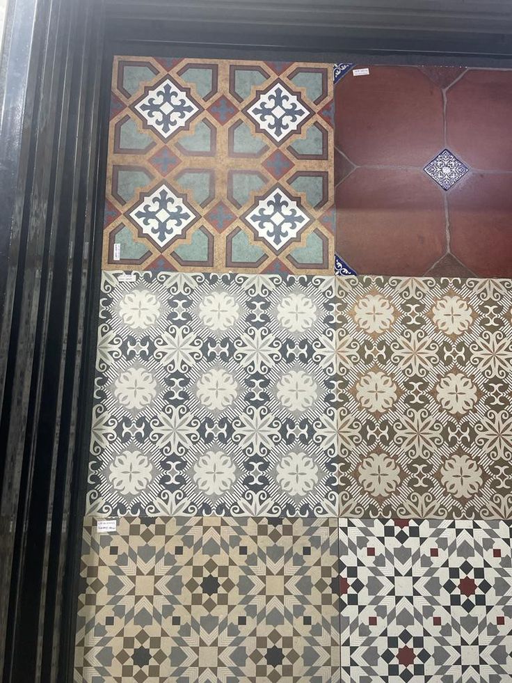 several different types of tile on display in a window sill, with the same pattern and color as well