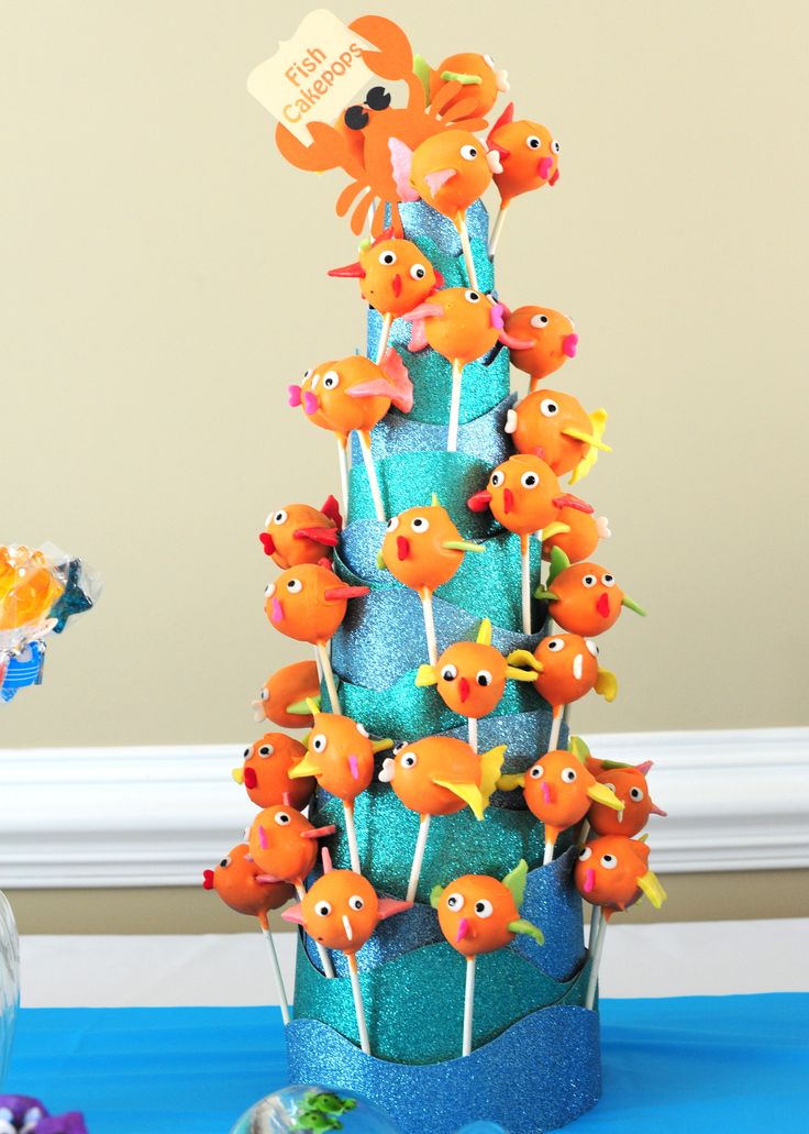 there is a cake decorated with fish on the table