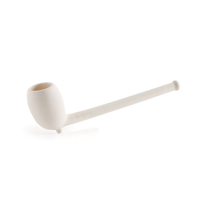 a white pipe sitting on top of a table