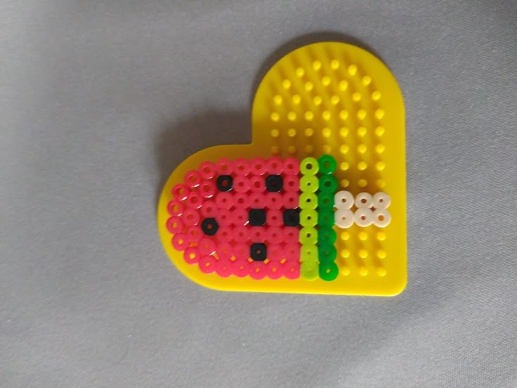 a heart shaped object made out of legos