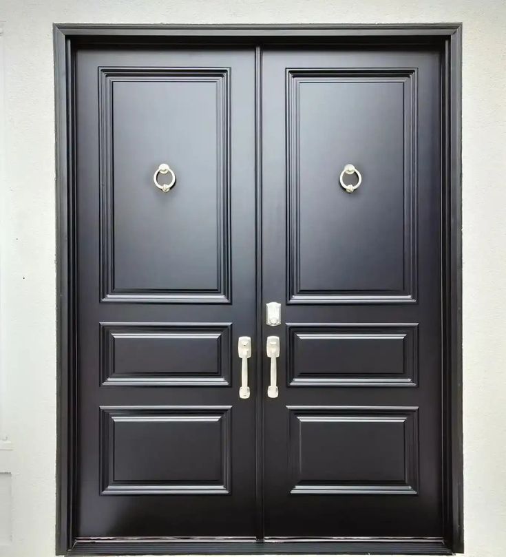 two black double doors with handles on each side