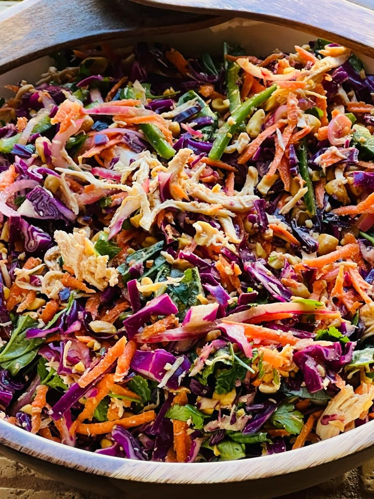 a large bowl filled with lots of colorful vegetables