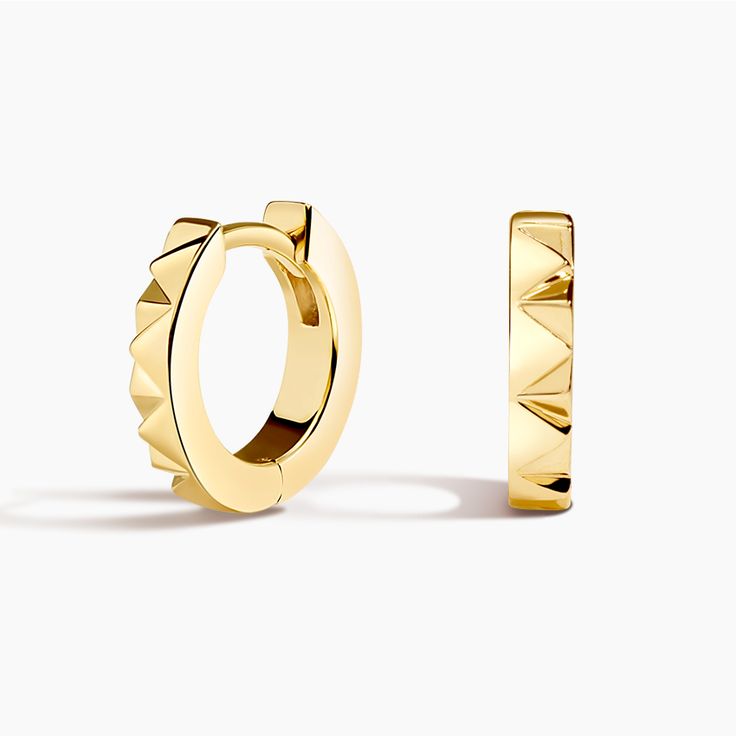 Sol Huggie Hoop Ears - 14K Yellow Gold. A single edge of bright-cut border radiates from this pair of super stackable huggie hoop earrings. Huggie Hoop: 12mm tall, 2.5mm wide. 

 Sol is a collection that invites you to embrace your inner light. By capturing the symbolism of the sun, it encourages the celebration of love, authenticity, and gratitude. Stackable Huggie Hoop Earrings In Yellow Gold, White Gold Stackable Huggie Hoop Earrings, Stackable Yellow Gold Hoop Huggie Earrings, Stackable Yellow Gold Huggie Hoop Earrings, Luxury Diamond Cut Huggie Earrings, Yellow Gold Stackable Hoop Huggie Earrings, Diamond Cut Huggie Earrings, Fine Jewelry Yellow Gold Huggie Earrings With Halo, 14k Gold Huggie Earrings With Halo