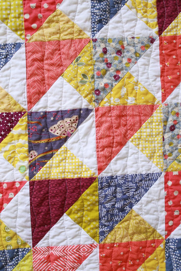 the quilt is made up and has many different colors