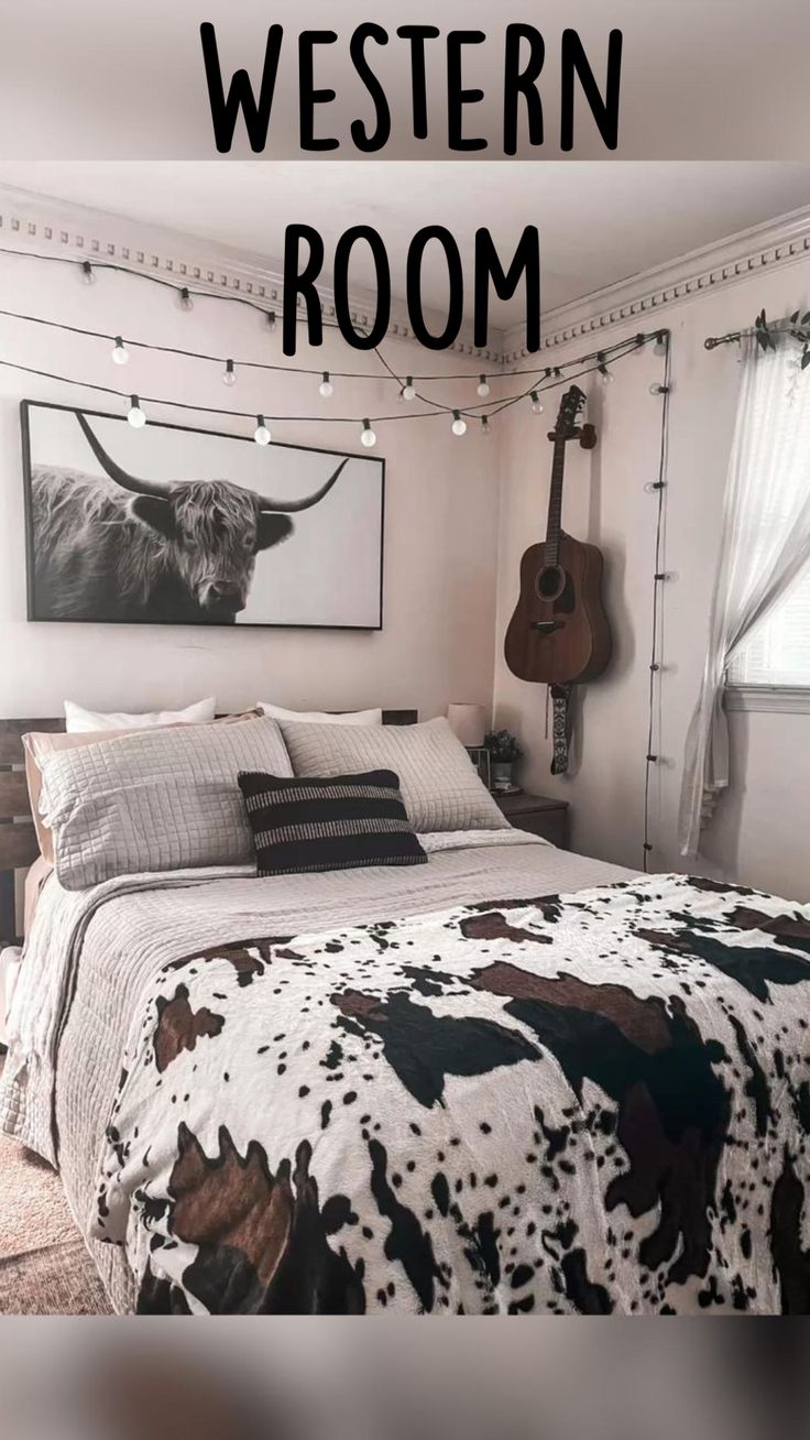 a bed room with a guitar hanging on the wall and a cow print comforter