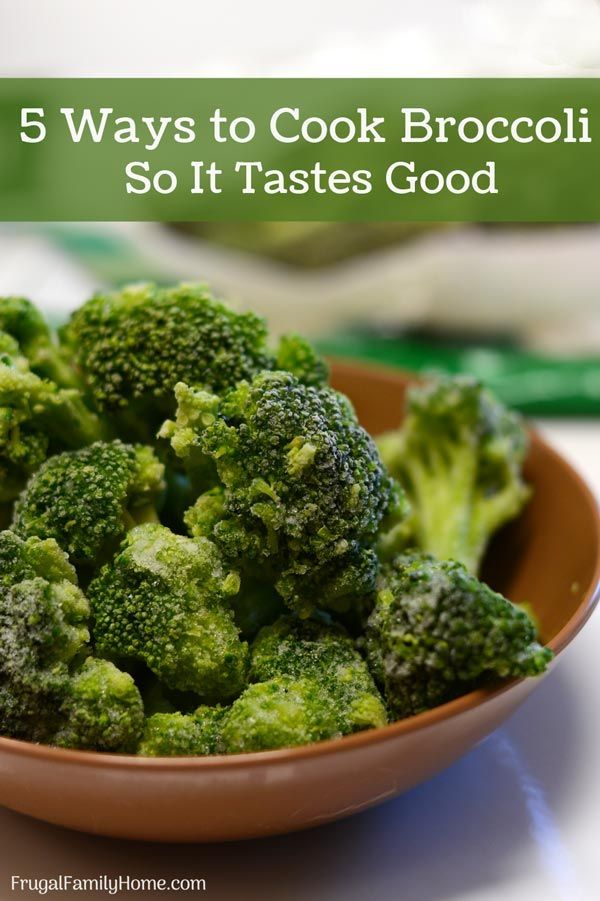 a bowl filled with broccoli sitting on top of a table