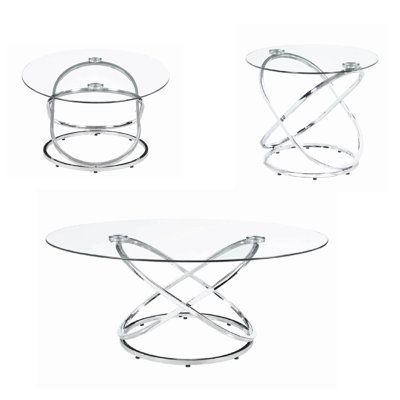 three glass tables with metal bases and one has a cross design on the top, two are