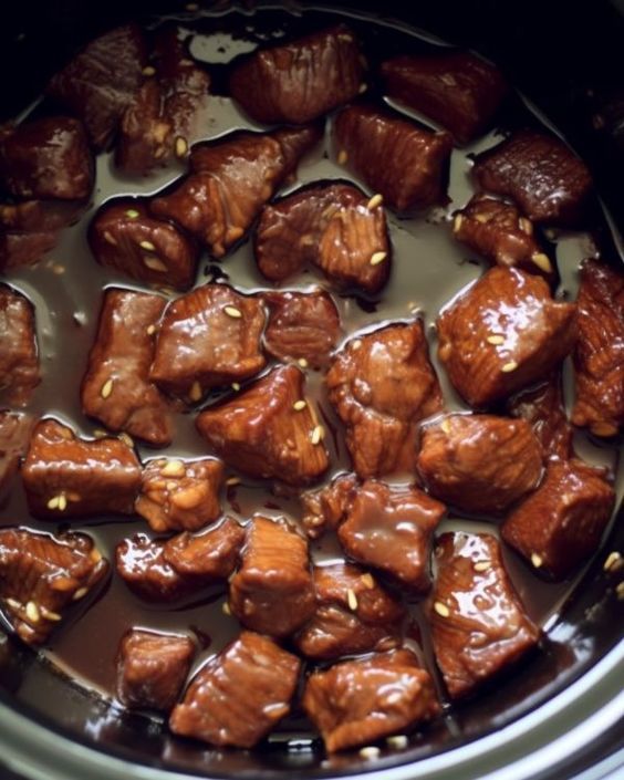 the food is being cooked in the slow cooker