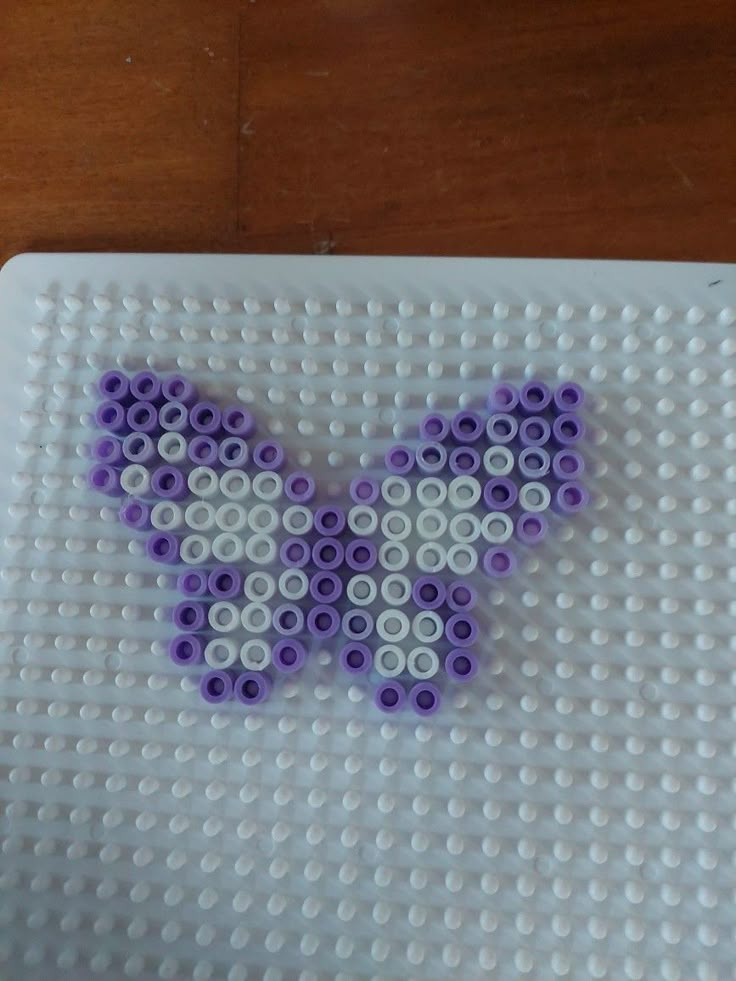 a close up of a lego butterfly on a table