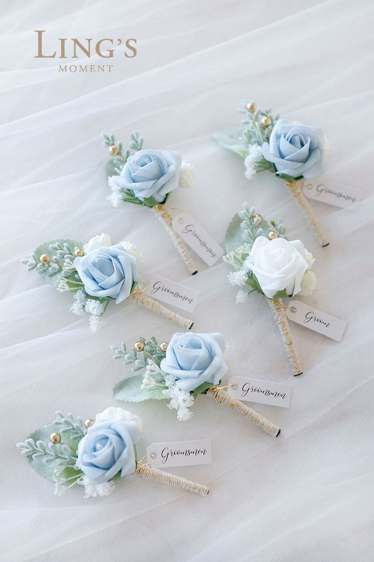 wedding hair pins with blue roses and greenery